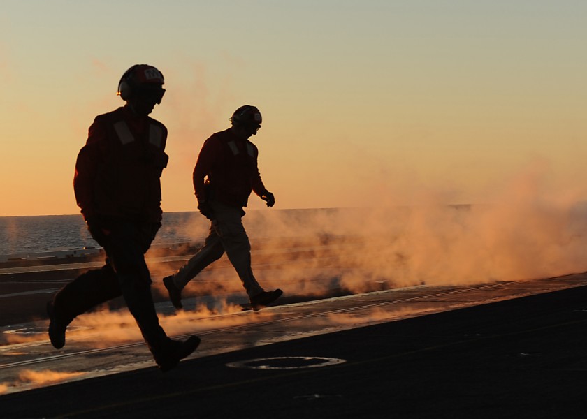 US Navy 100727-N-5386R-021 Flight deck personnel aboard the aircraft carrier USS Abraham Lincoln (CVN 72) clear a catapult after a launch