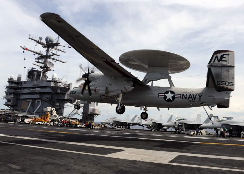 US Navy 101006-N-4973M-064 Landing signal officers communicate with the pilots as aircraft make their approach to the flight deck of the aircraft c