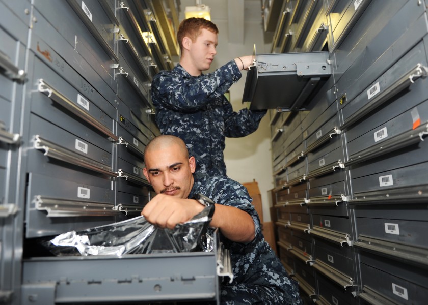 US Navy 101012-N-4997L-006 Logistic Specialist Seaman Luis Soltero, from Los Angeles, left, and Logistic Specialist Seaman Ryan Duff, from Middleto