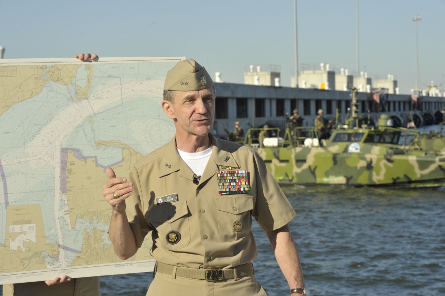 US Navy 101022-N-6889J-016 Rear Adm. Philip H. Cullom, director of the Energy and Environmental Readiness Division, briefs civic and military leade