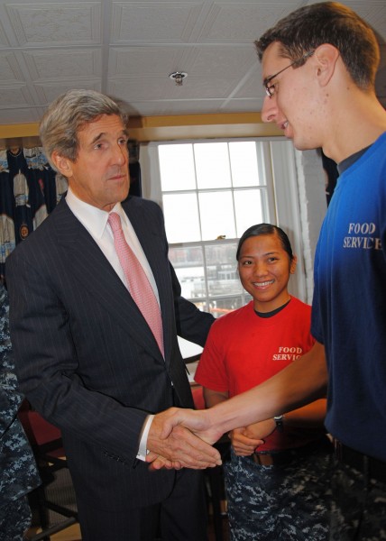 US Navy 101214-N-5647H-411 U.S. Senator John Kerry shakes hands with Airman Bryan Pickett in the galley for USS Constitution Sailors