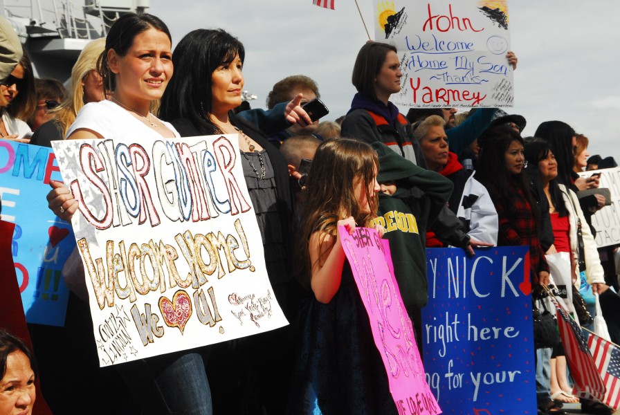 US Navy 110324-N-QW737-006 Family and friends wait for the arrival of the aircraft carrier USS Abraham Lincoln (CVN 72). Abraham Lincoln returned h