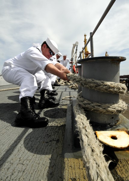 US Navy 110603-N-YM590-060 Sailors aboard USS Anzio (CG 68) heave a line as the ship pulls into Odessa, Ukraine, for a port visit
