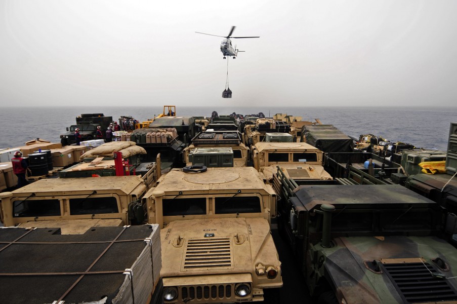 US Navy 110613-N-RC734-032 An AS-332 Super Puma helicopter delivers cargo aboard USS Comstock (LSD 45) during a vertical replenishment