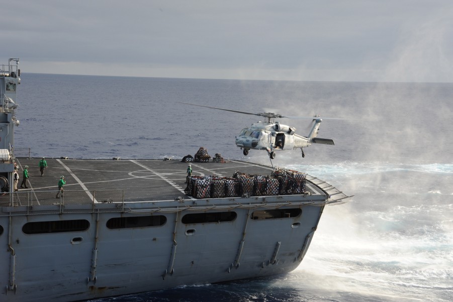 US Navy 110705-N-ZZ999-025 An MH-60S Sea Hawk helicopter assigned to the Sea Knights of Helicopter Sea Combat Squadron (HSC) 22 carries cargo from 