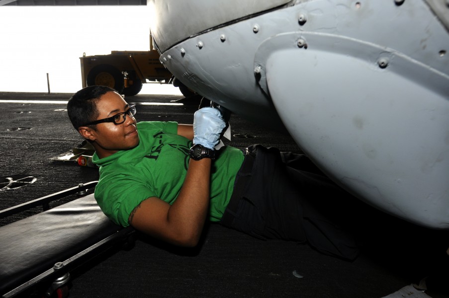 US Navy 110719-N-ZZ999-007 Aviation Structural Mechanic 3rd Class Angelina Rhines, from Phoenix, installs panels on an HH-60H Sea Hawk helicopter