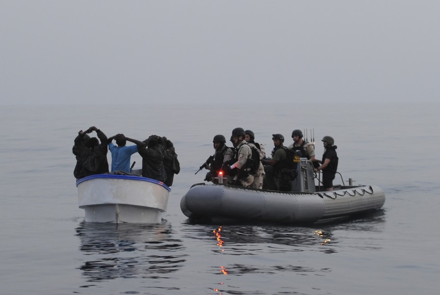 US Navy 110722-N-TY225-318 A visit, board, search and seizure team investigates a suspected pirate skiff