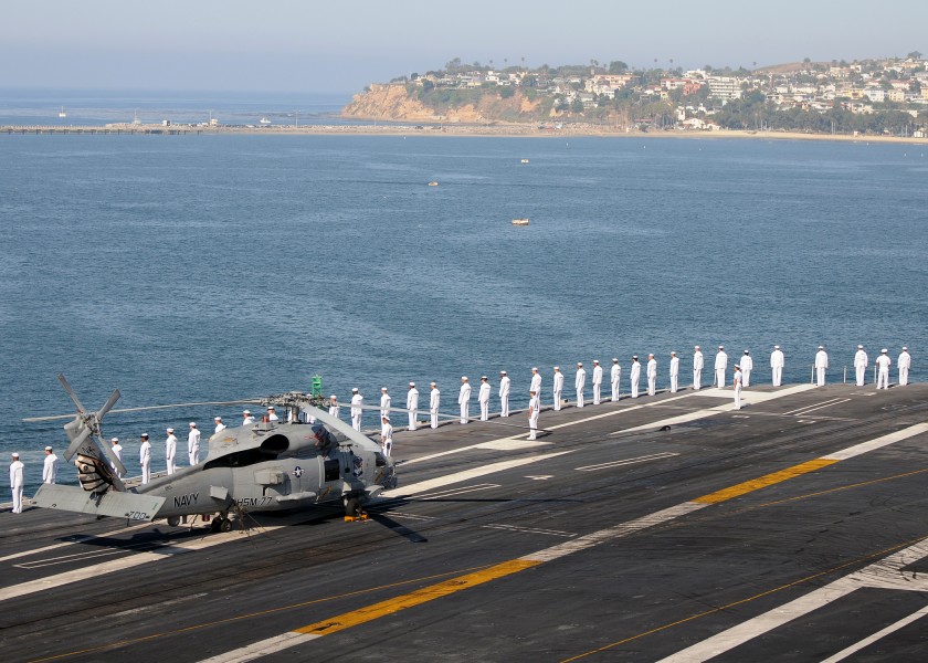 US Navy 110725-N-JN612-194 Sailors man the rails on the flight deck of the aircraft carrier USS Abraham Lincoln (CVN 72) as the ship pulls into Los