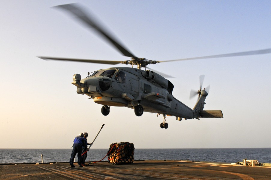 US Navy 110811-N-YM590-071 Sailors connect a cargo pendant to an SH-608