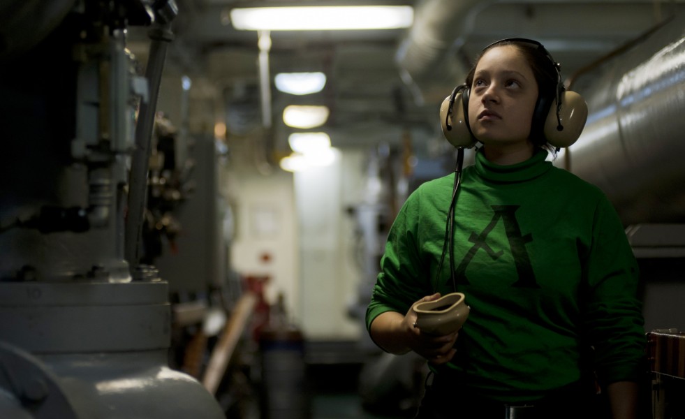 US Navy 110924-N-TU221-206 Aviation Boatswain's Mate (Equipment) Airman Gabrielle Dewitt makes rounds while standing watch inside an arresting gear