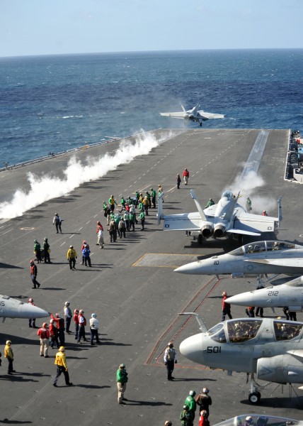 US Navy 111006-N-YB753-077 Aircraft assigned to Carrier Air Wing (CVW) 2 launch from the flight deck of the Nimitz-class aircraft carrier USS Abrah