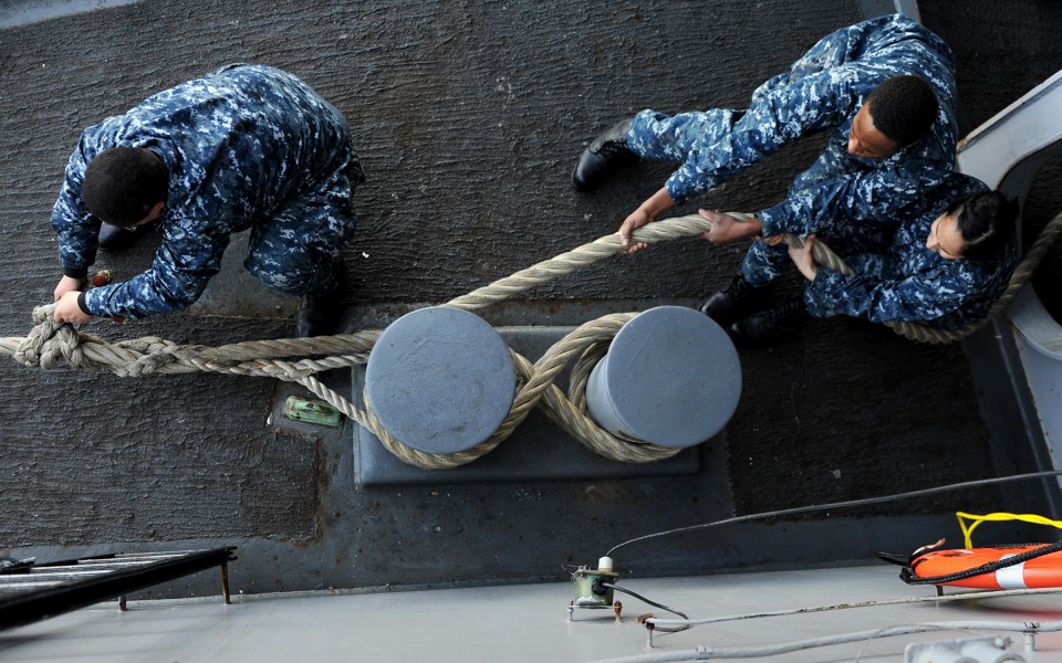 US Navy 111018-N-QN361-117 Deck department Sailors secure a line aboard the aircraft carrier USS Abraham Lincoln (CVN 72)
