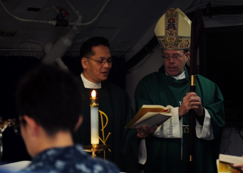 US Navy 111025-N-BH789-046 Bishop Neal J. Buckon, auxiliary bishop of the Archdiocese for the Military Services, leads a prayer during a Roman Cath