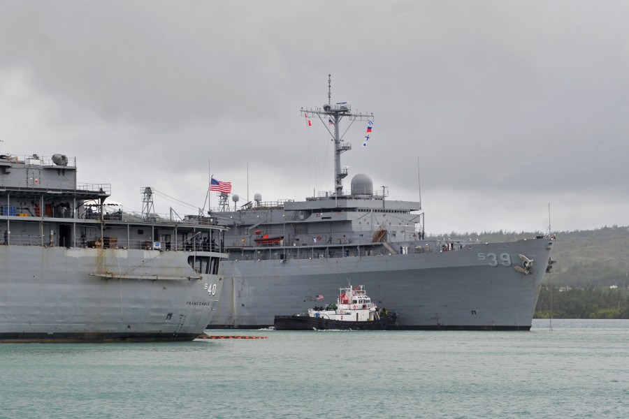 US Navy 111214-N-WG146-007 The submarine tender USS Emory S. Land (AS 39) performs a coordinated mooring behind the Navy's only other submarine ten