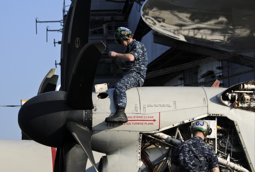 US Navy 120110-N-JN612-065 Two Sailors assigned to the Sun Kings of Airborne Early Warning Squadron (VAW) 116 conduct maintenance on the turbine of
