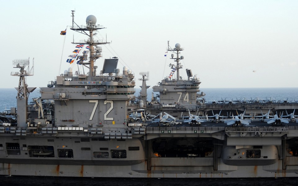 US Navy 120119-N-QH883-199 The Nimitz-class aircraft carriers USS Abraham Lincoln (CVN 72) and USS John C. Stennis (CVN 74) join for a turnover of 
