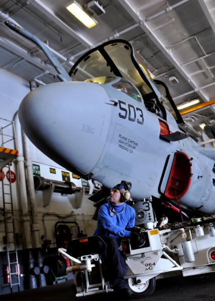 US Navy 120120-N-JY929-024 Aviation Boatswain's Mate (Handling) Airman Joseph Alsup maneuvers an EA-6B Prowler assigned to the Lancers of Electroni