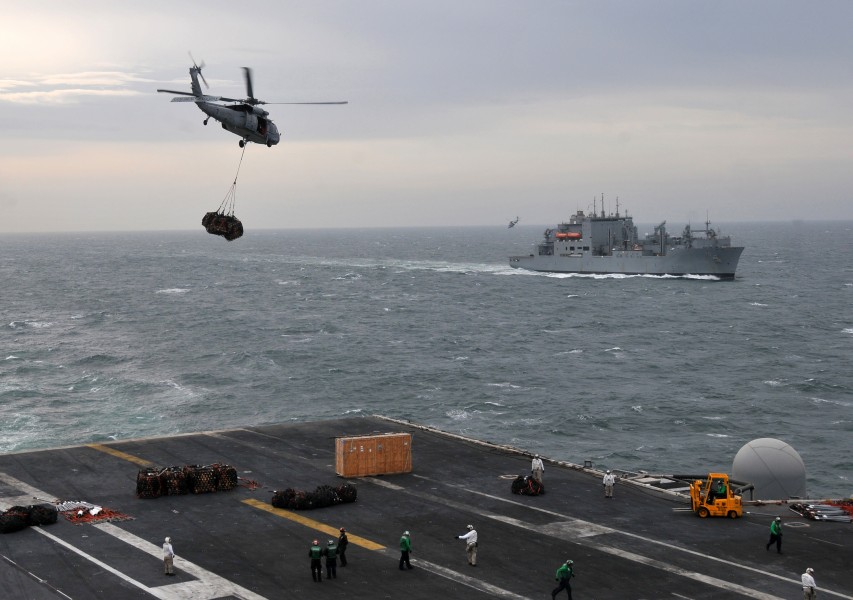 US Navy 120213-N-VC888-041 An MH-60S Sea Hawk helicopter assigned to the Golden Falcons of Helicopter Sea Combat Squadron (HSC) 12 delivers cargo t