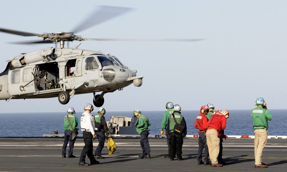 US Navy 120214-N-DH811-030 An MH-60S Sea Hawk helicopter assigned to the Golden Falcons of Helicopter Sea Combat Squadron (HSC) 12 takes off from t