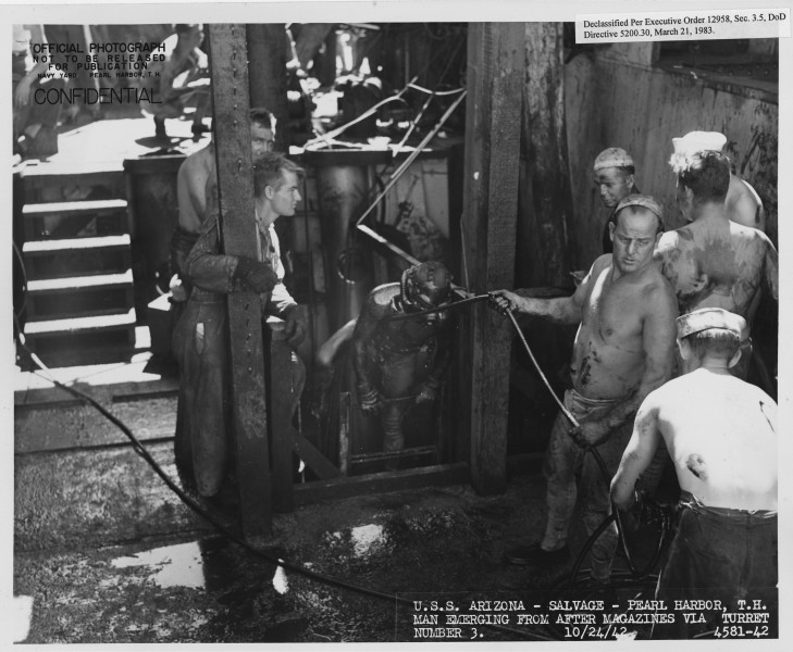USS Arizona- Salvage- Pearl Harbor, TH. Man emerging from after magazines via turret number 3. 10-24-42, 4581-42 - NARA - 296945