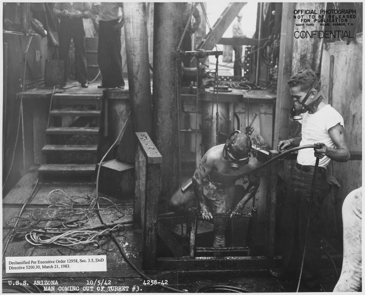 USS Arizona 4358-42, Man coming out of turret ^3 - NARA - 296935