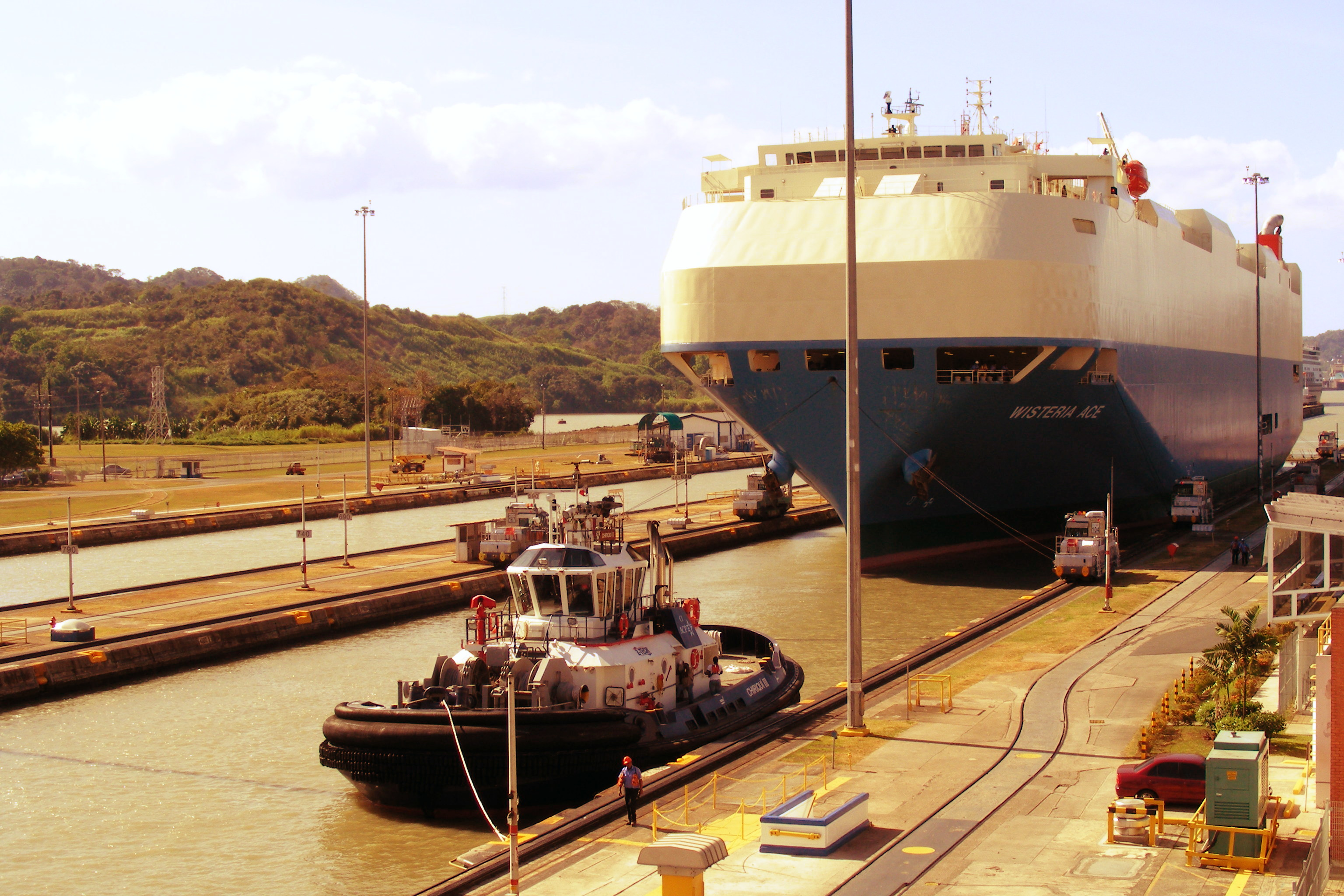 Tugboat and a Ship - Panama Canal