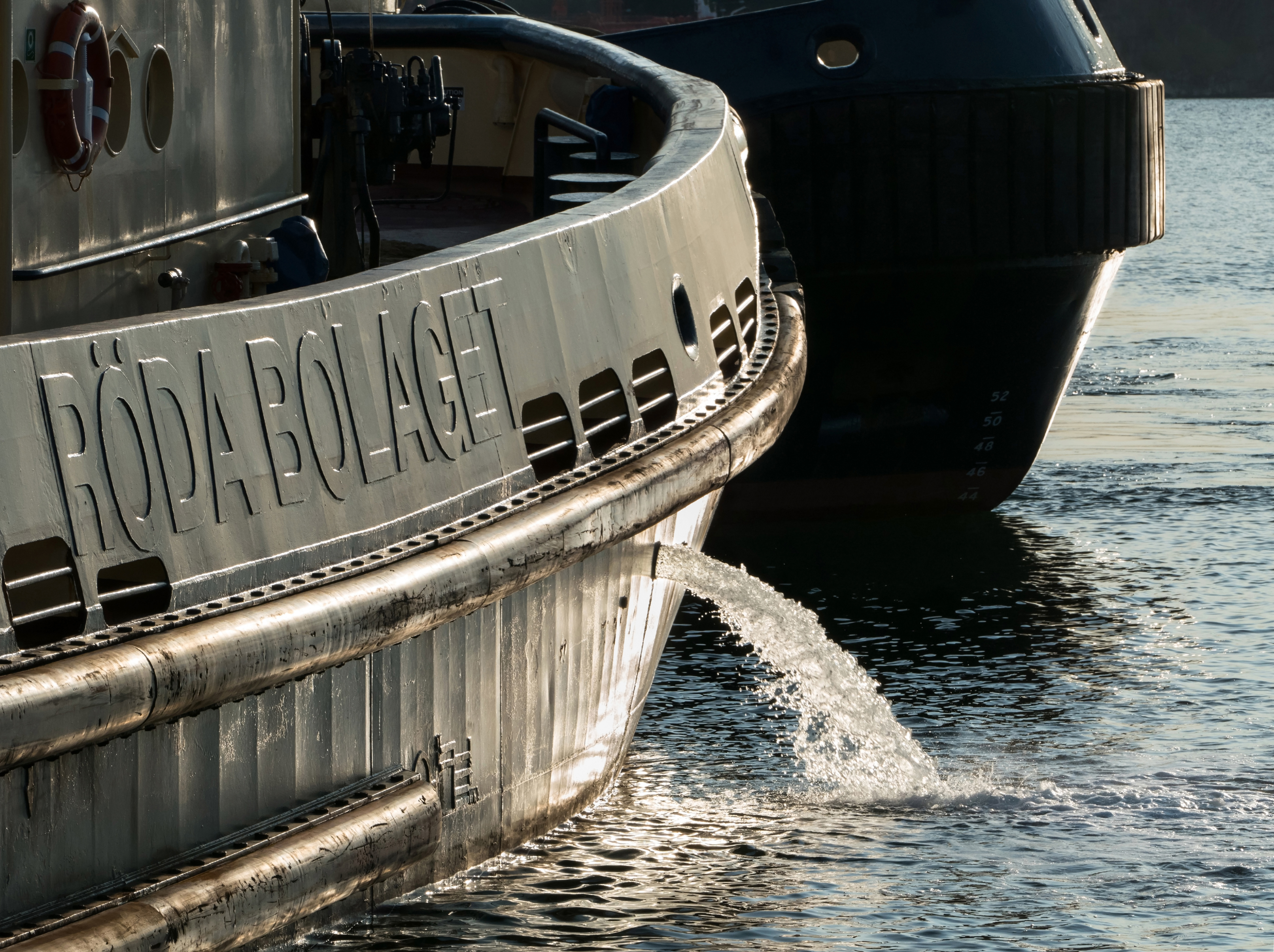 Tugboat Boss discharging ballast water before departure