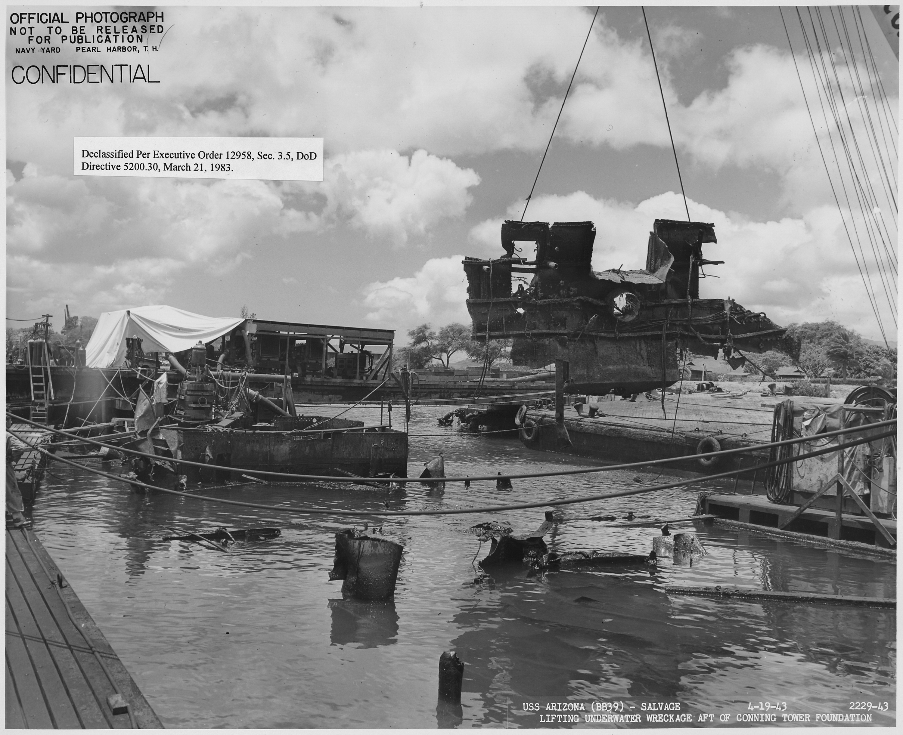 US Arizona (BB39)- Salvage, 2229-43, Lifting underwater wreckage aft of conning tower foundation - NARA - 296933
