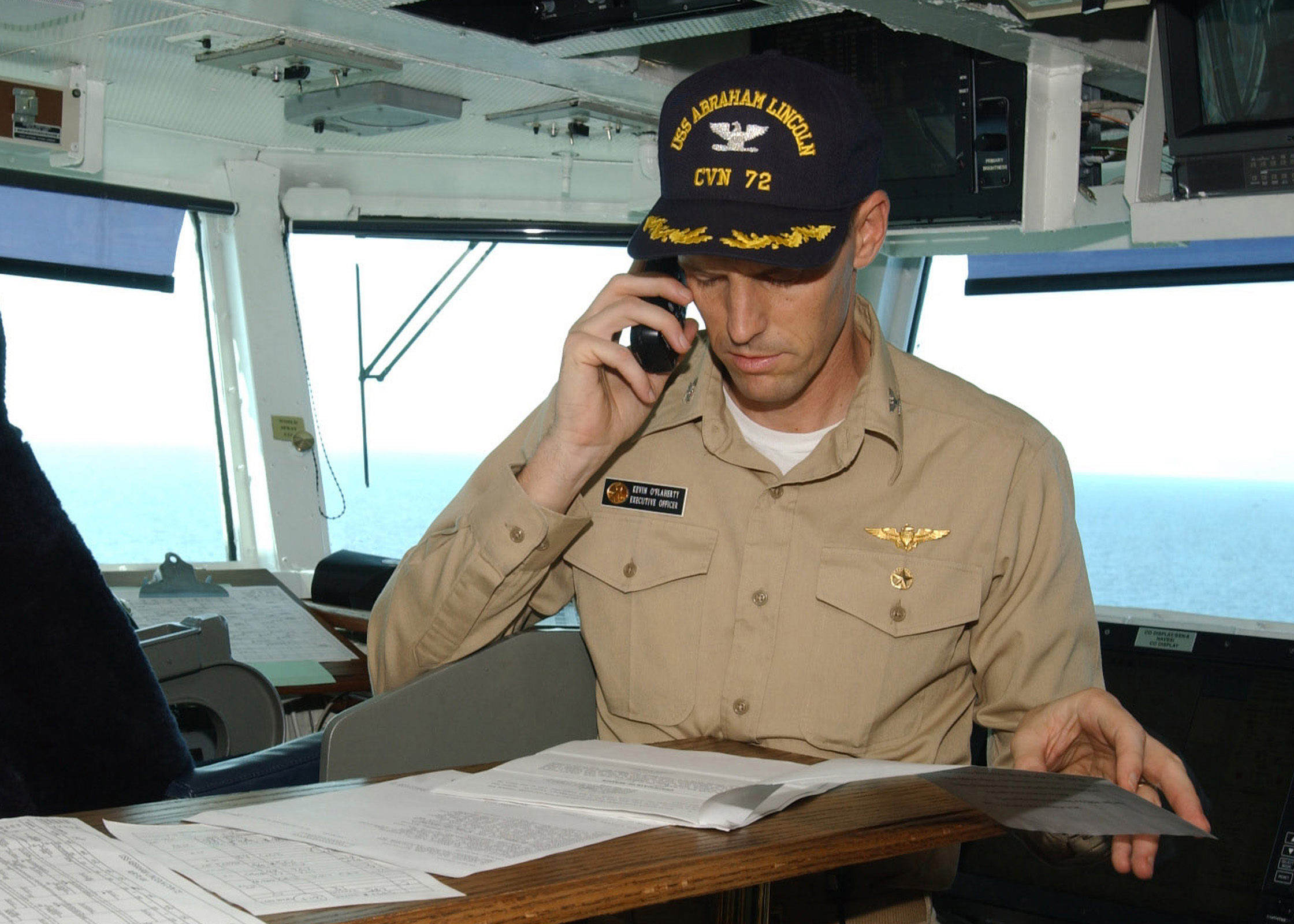 US Navy 021011-N-6817C-004 CVN 72 XO conducts business on the ship's bridge