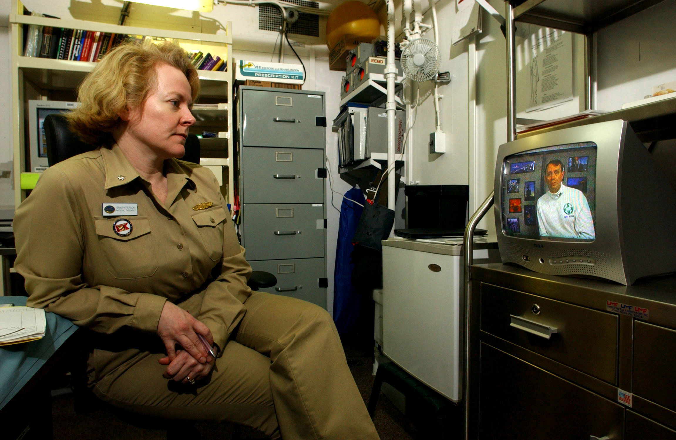 US Navy 030316-N-4308O-015 Cdr. Erin Patterson, Medical Officer aboard USS Harry S. Truman (CVN 75), watches a 'safety stand-down video' in her office