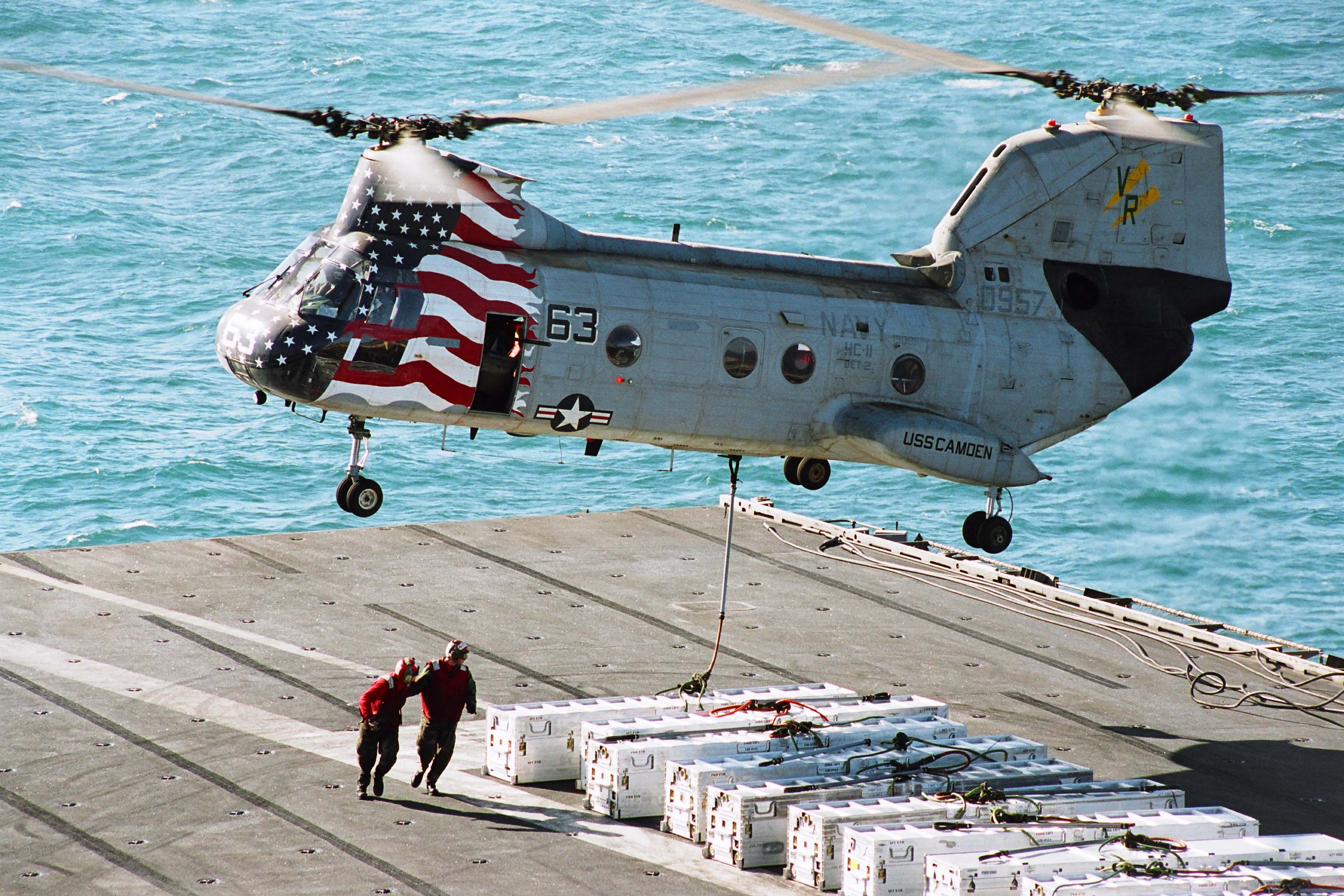 US Navy 030328-N-5292M-024 Sailors assigned to Weapon's department attach a pendant to a CH-46 Sea Knight assigned to Helicopter Combat Support Squadron Eleven Detachment Five (HC-11 Det. 5) 