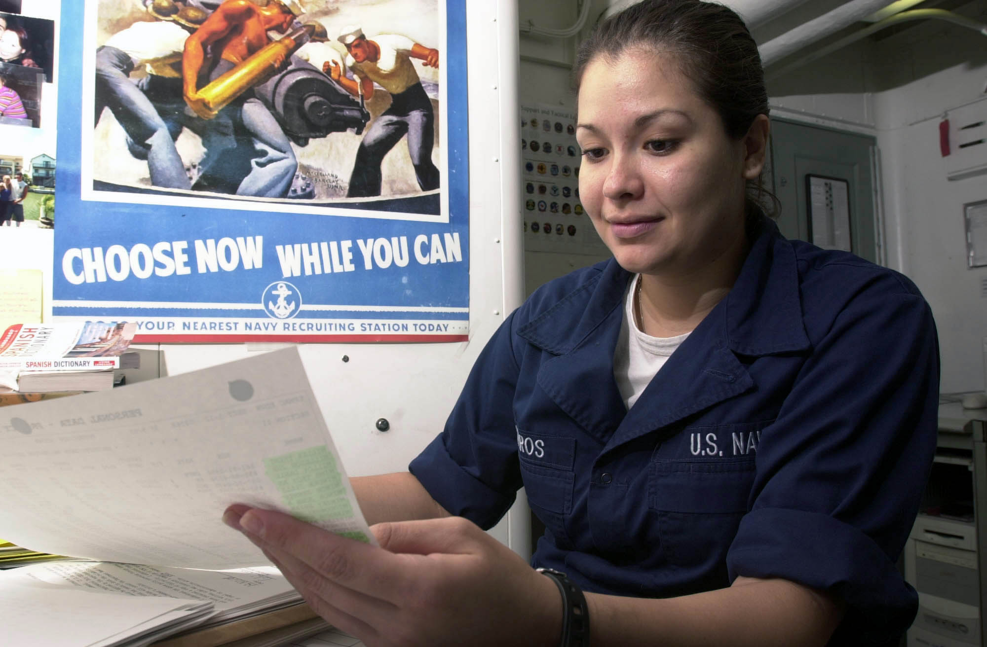 US Navy 030411-N-1577S-001 Personnelman Robin Cisneros of Corpus Christi, Texas reviews the enrollment sheet for English 1301 in the Education Services Office aboard USS Nimitz (CVN 68)