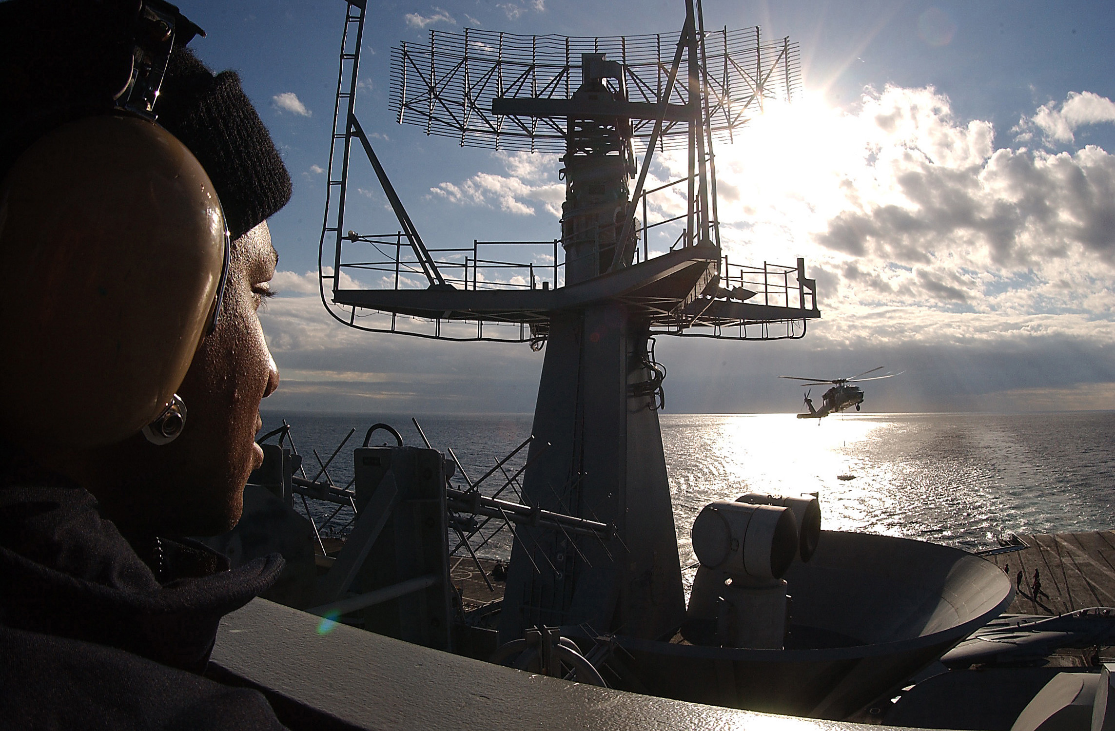 US Navy 031110-N-6278K-002 Seaman Okpara Kelly stands the aft lookout watch on the signal bridge aboard USS George Washington (CVN 73)