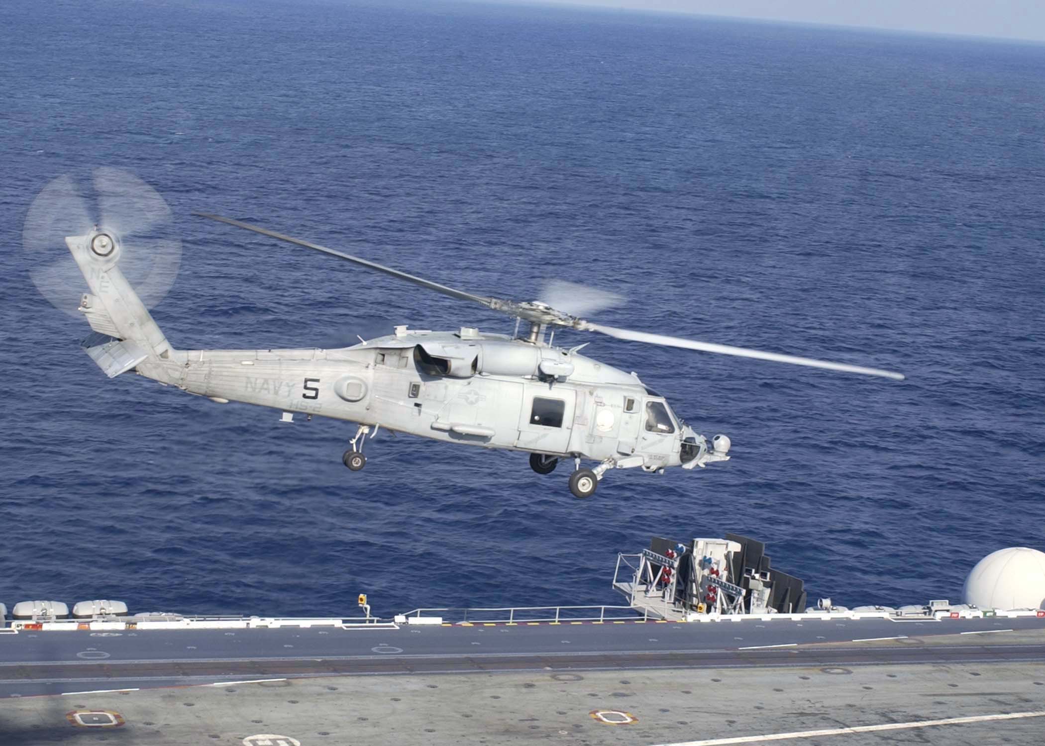 US Navy 040811-N-1229B-018 An SH-60F assigned to the Light Helicopter Anti-Submarine Four Seven (HSL-47), takes off from the aircraft carrier USS Abraham Lincoln (CVN 72)