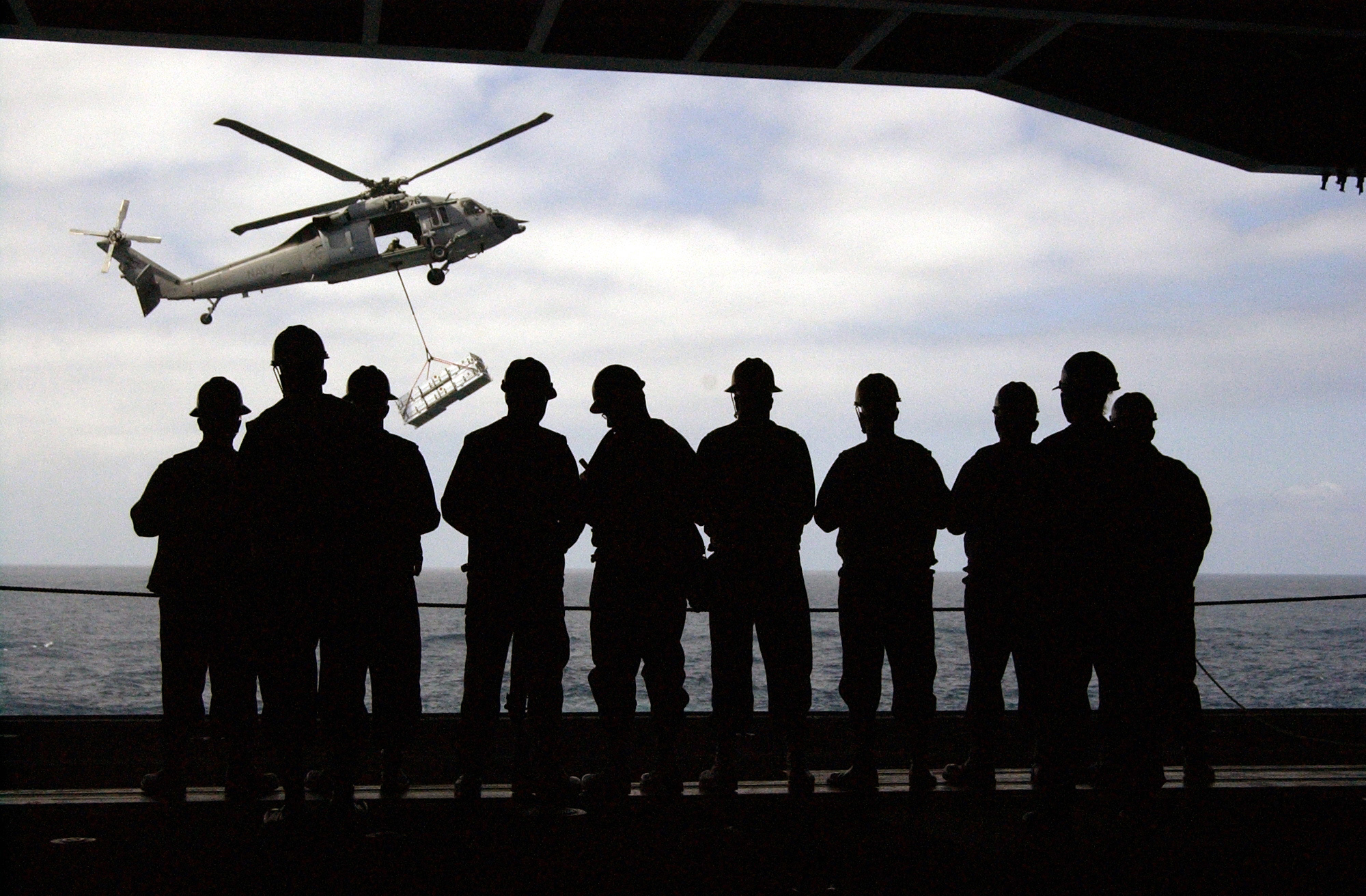 US Navy 050529-N-5549O-235 Sailors assigned to the Deck Department aboard the Nimitz class aircraft carrier USS Ronald Reagan (CVN 76) standby for an underway replenishment