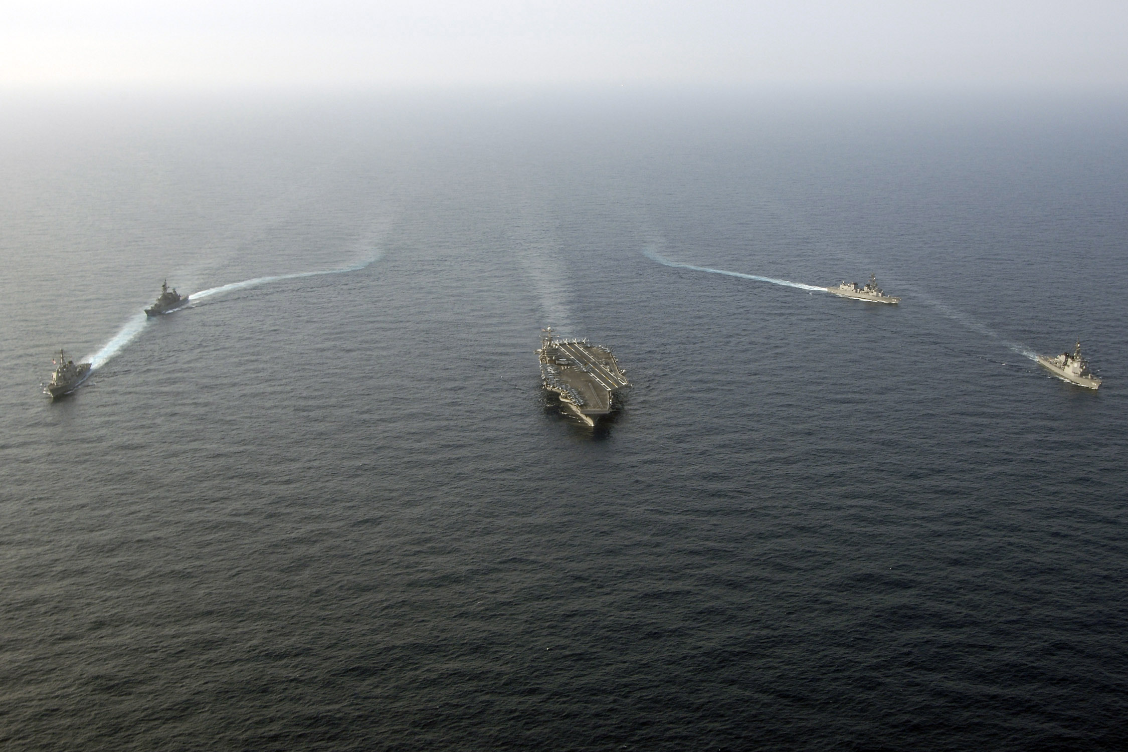 US Navy 060323-N-6074Y-103 Guided-missile destroyer USS Stethem (DDG 63) and Japanese Maritime Self-Defense Force (JMSDF) ships sail in formation during a passing exercise (PASSEX)