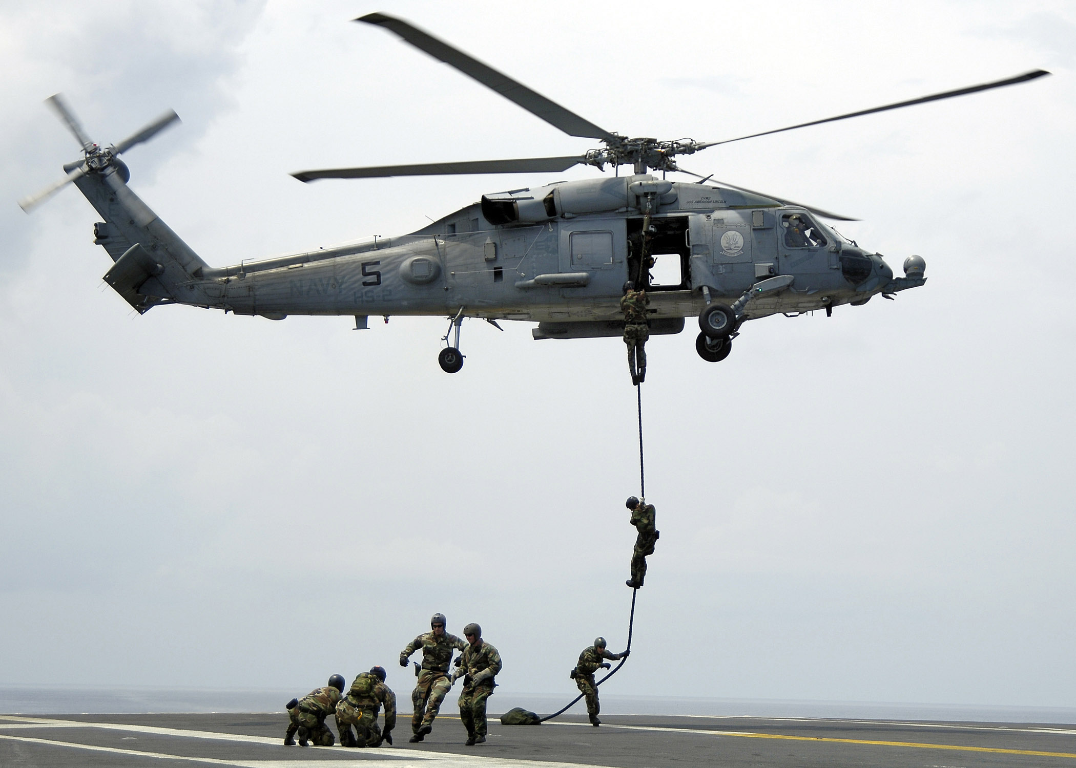 US Navy 060417-N-4166B-068 Members of Explosive Ordnance Disposal Mobile Unit Eleven (EODMU-11) Detachment 9, fast rope from an SH-60F Seahawk helicopter