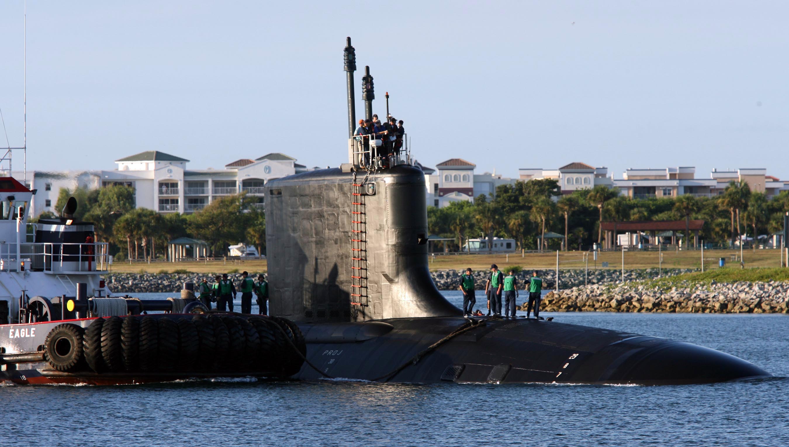 US Navy 060825-N-7441H-004 The Virginia-class attack submarine USS Texas (SSN 775) is guided into port by local tugboats near Port Canaveral