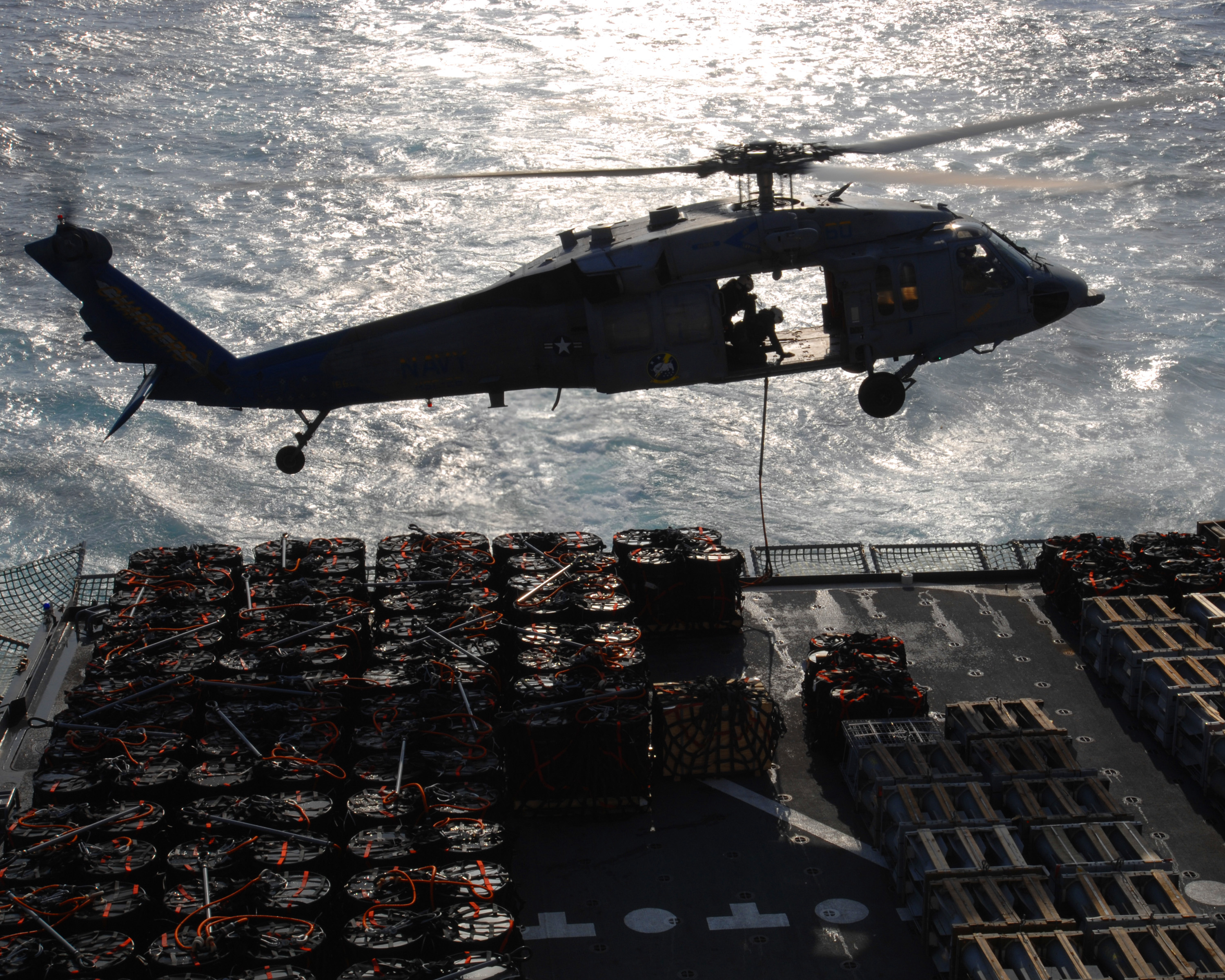 US Navy 061215-N-9708H-294 An MH-60S Seahawk helicopter assigned to Helicopter Sea Combat Squadron Two Six (HSC-26), station at Naval Station Norfolk, conducts a vertical replenishment