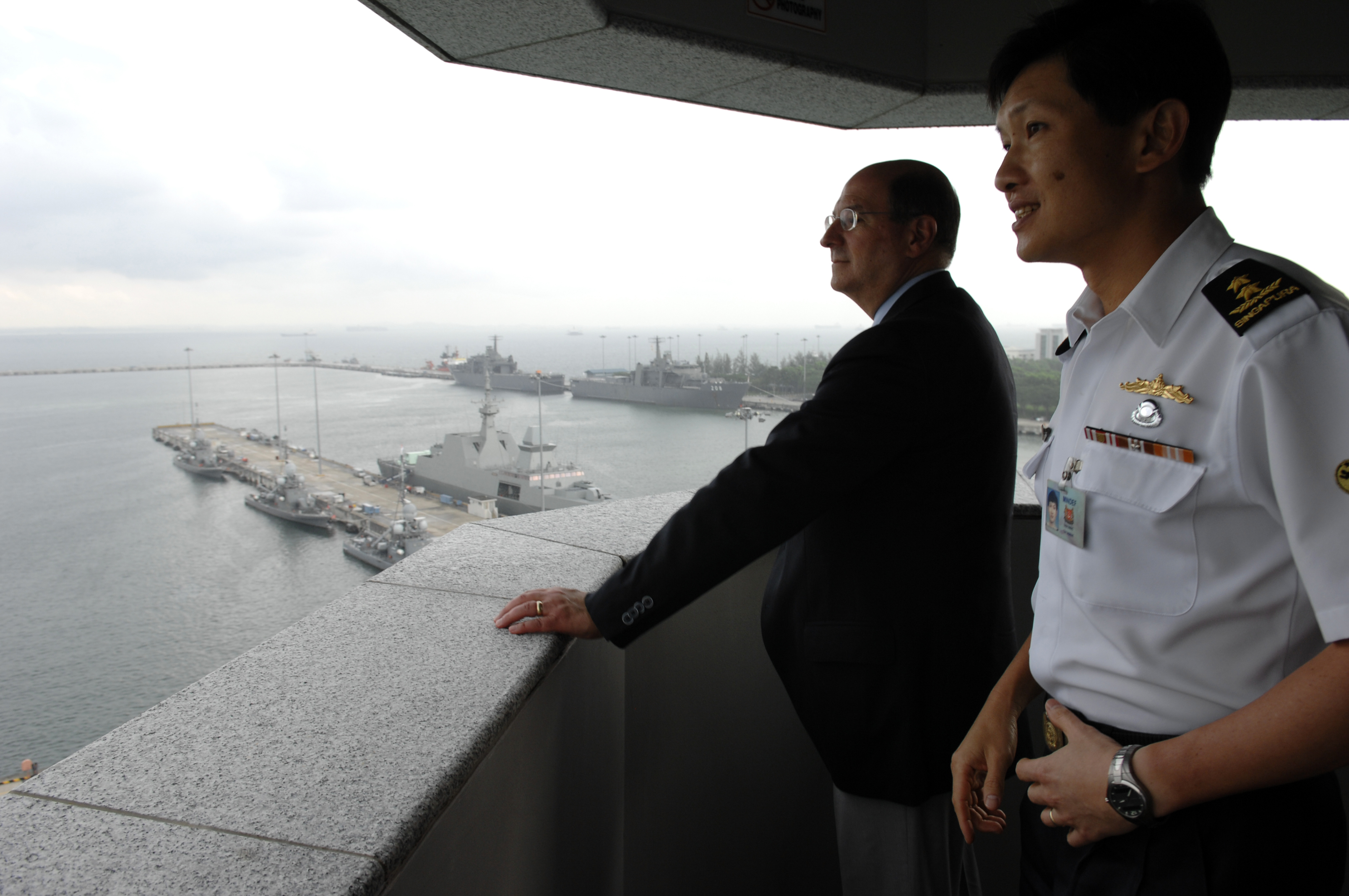 US Navy 070821-N-3642E-163 Singapore's Chief of the Navy Rear Adm. Ronnie Tay briefs Secretary of the Navy (SECNAV) the Honorable Dr. Donald C. Winter on port facilities at Changi Naval Base