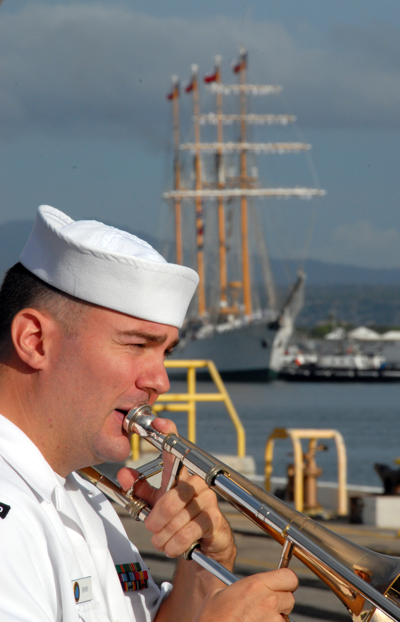 US Navy 071004-N-0879R-011 A Sailor from U.S. Pacific Fleet Band plays as Chilean tall ship Esmeralda (BE 43) makes her way pierside to Naval Station Pearl Harbor