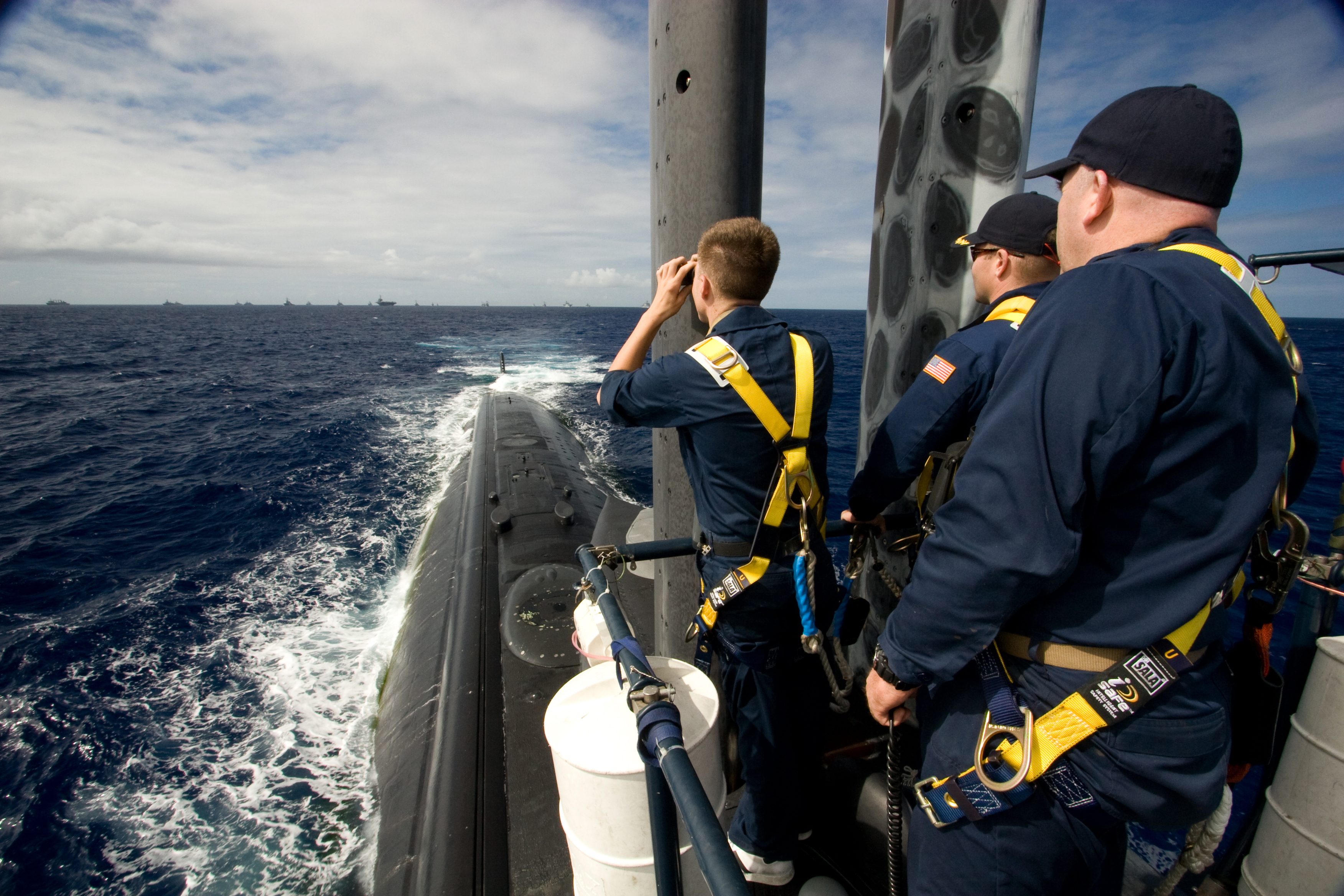 US Navy 080729-N-8061H-086 ailors aboard the fast-attack submarine USS Los Angeles (SSN 688) watch from the bridge as ships from multiple nations gather in a 26-ship formation
