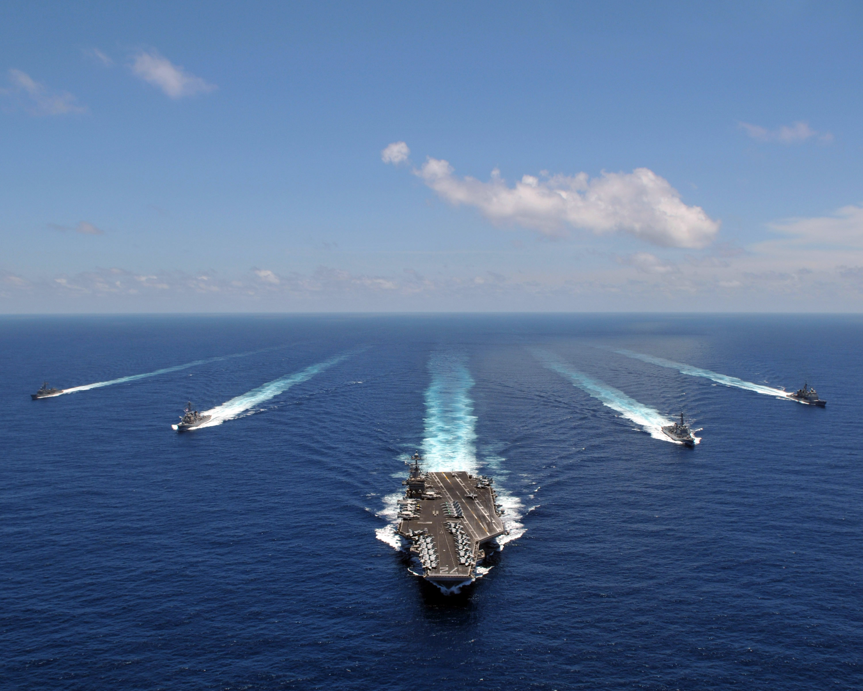 US Navy 080905-N-7981E-845 The aircraft carrier USS Abraham Lincoln (CVN 72) leads a formation of ships from the Abraham Lincoln Strike Group they transit the Indian Ocean
