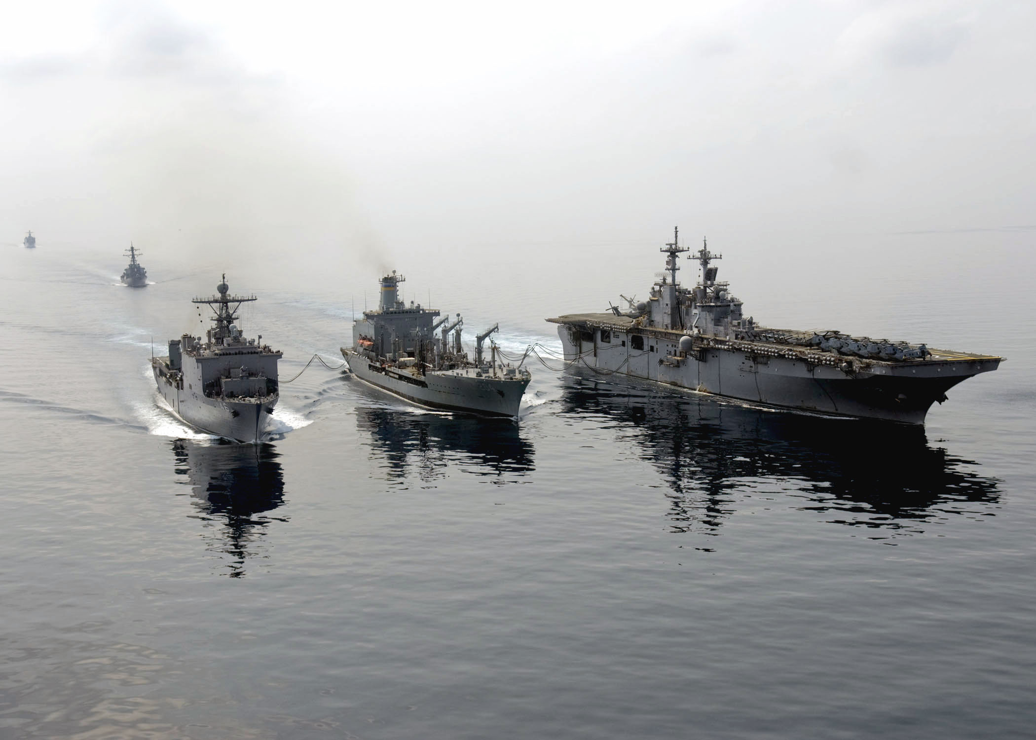 US Navy 090206-N-5253W-085 USS Tortuga (LSD 46) and USS Essex (LHD 2) steam alongside USNS Rappahannock (T-AO 204)
