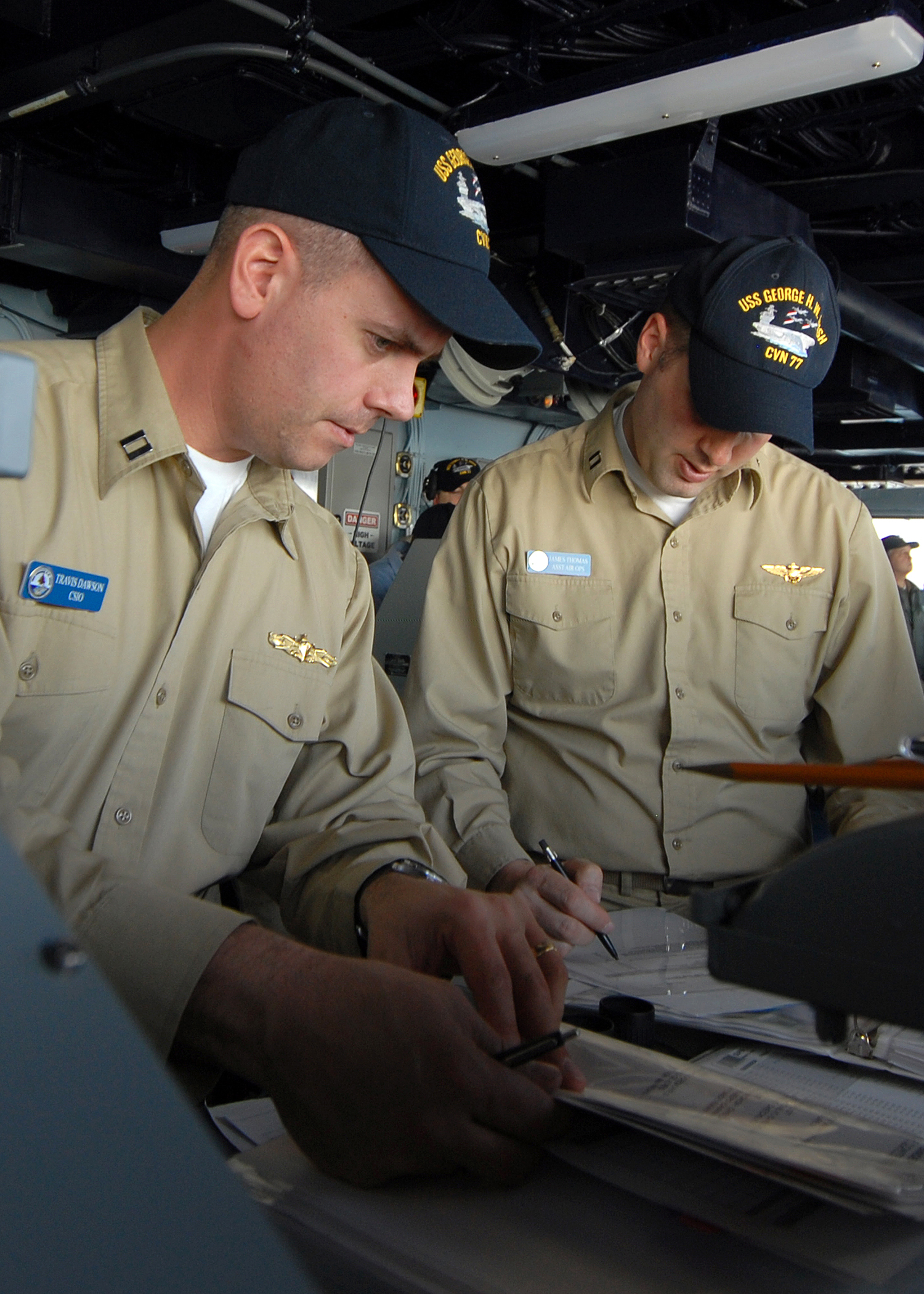 US Navy 090213-N-5658B-016 Lt. Travis Dawson and Lt. James Thomas stand bridge watch