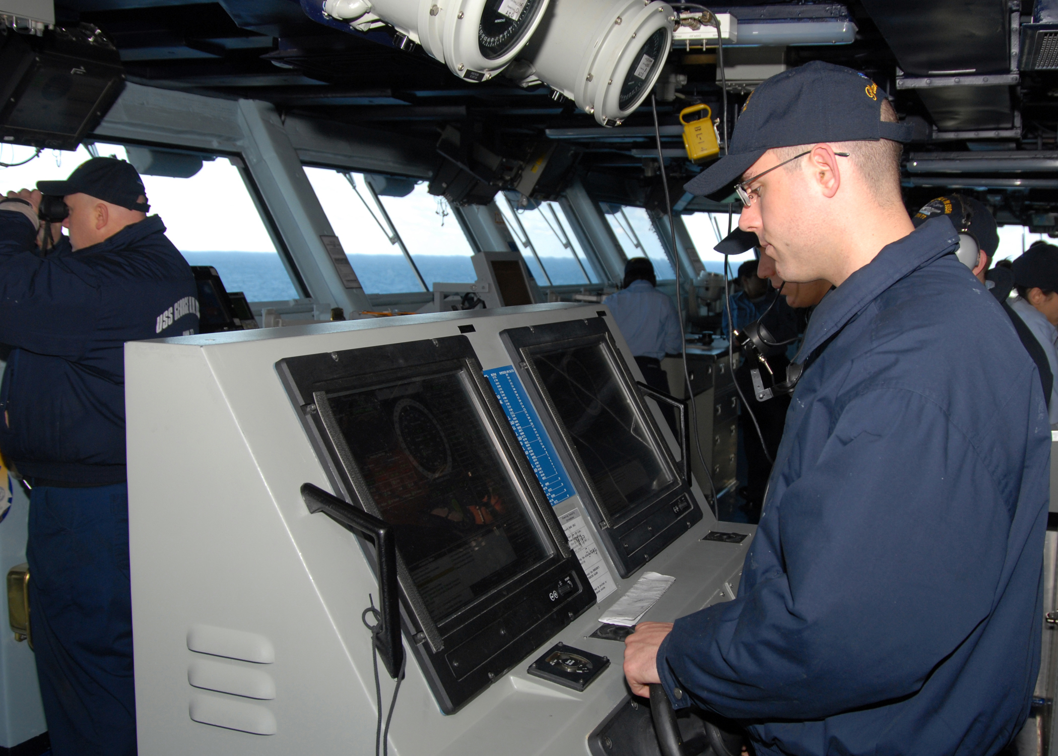 US Navy 090215-N-3548M-003 Sailors stand lee helm and helmsman watch