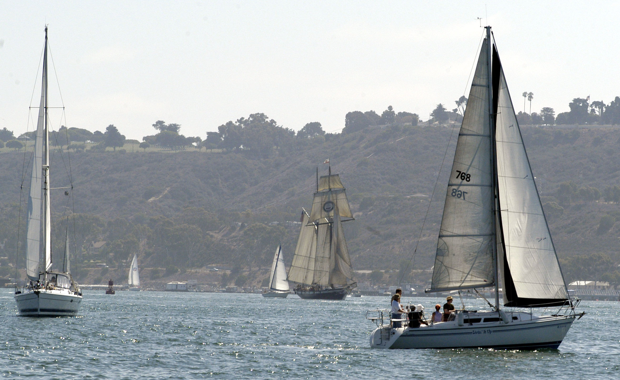 US Navy 090815-N-3927C-005 Submarine Sailors assigned to Submarine Squadron (SUBRON) 11, handle the sails and pilot 40-foot Catalina sloops off of Point Loma