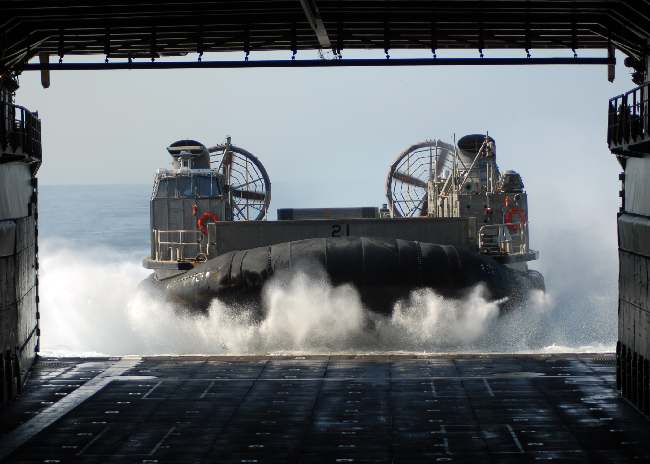 US Navy 100304-N-6692A-032 Landing Craft Air Cushion (LCAC) 21 assigned to Assault Craft Unit (ACU) 5, enters the well deck of the amphibious dock landing ship USS Harpers Ferry (LSD 49) d