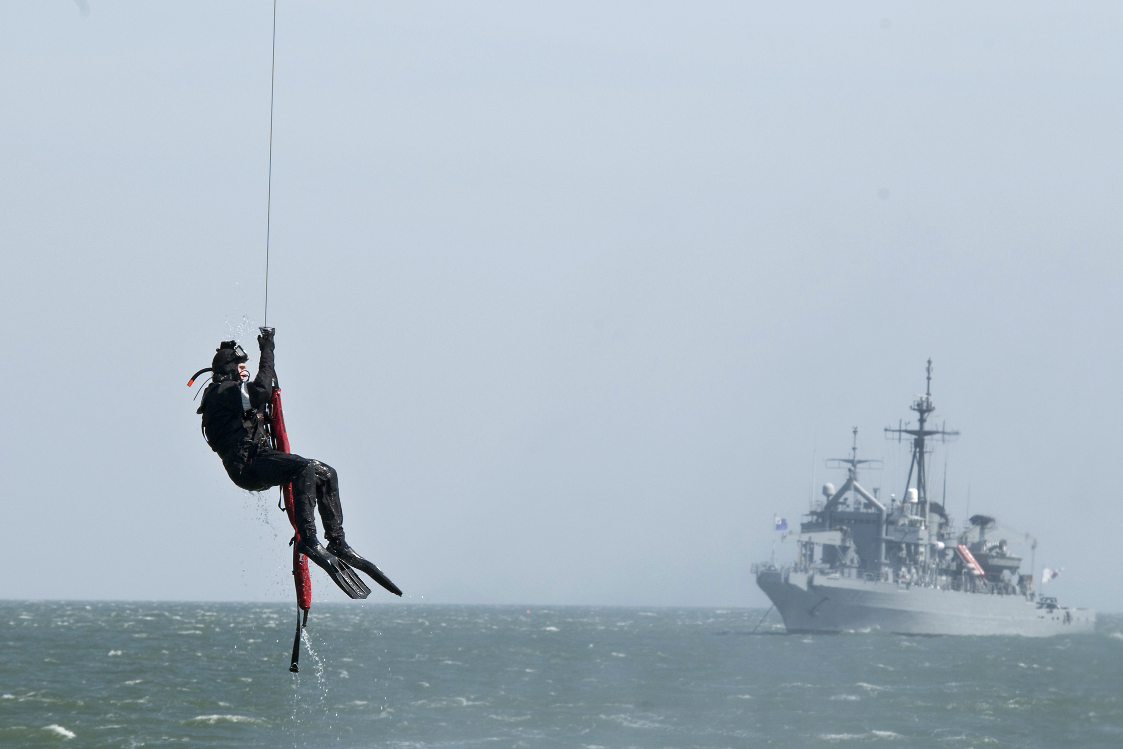 US Navy 100406-N-9123L-010 A diver is recovered by helicopter during a medical evacuation training exercise involving the U.S. and Republic of Korea navies