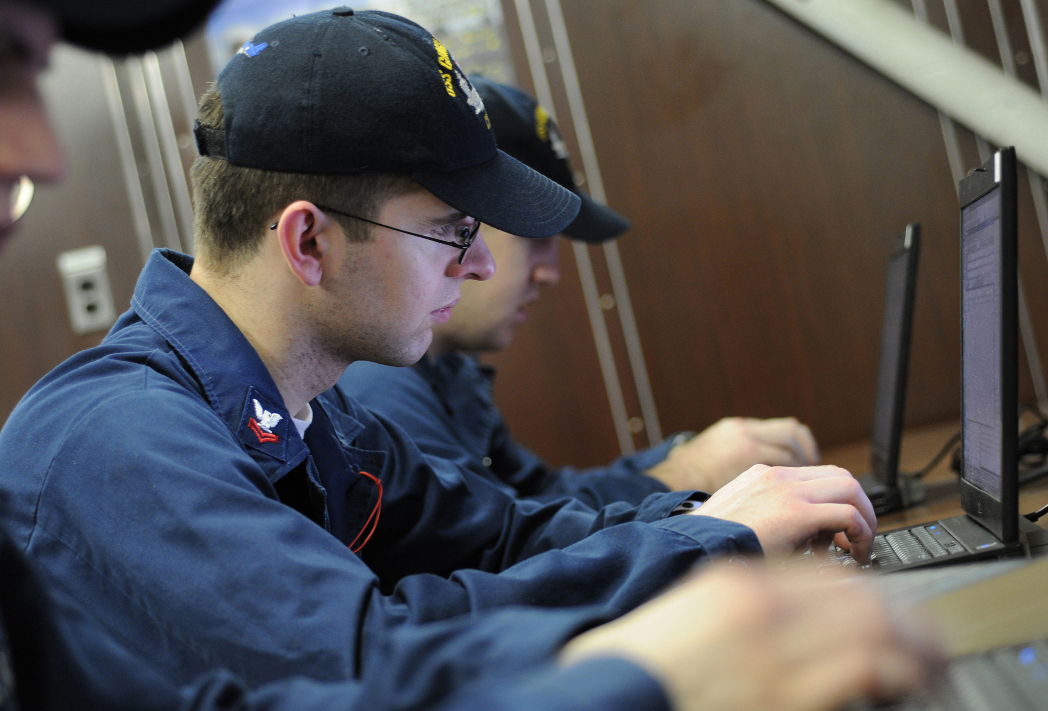 US Navy 100419-N-8913A-047 Sailors assigned to the aircraft carrier USS George H.W. Bush (CVN 77) check their e-mail in the ship's library